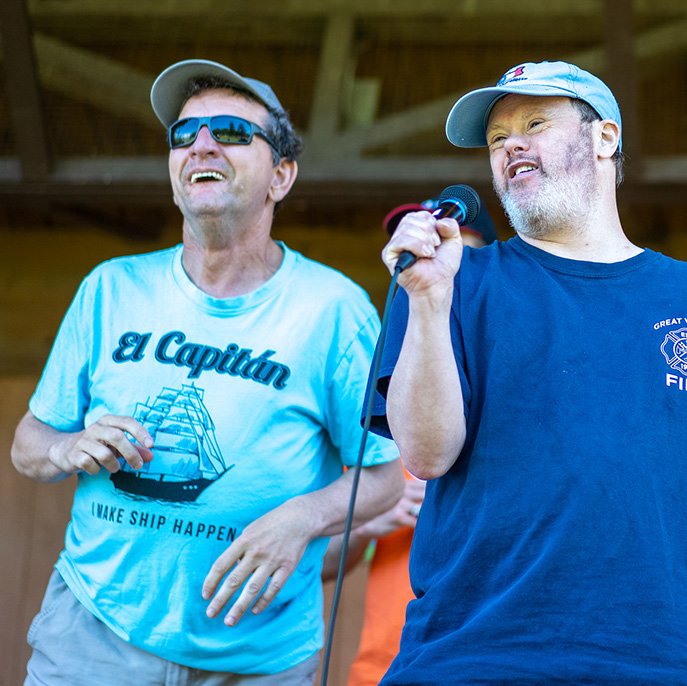 atlantic region two men on stage singing